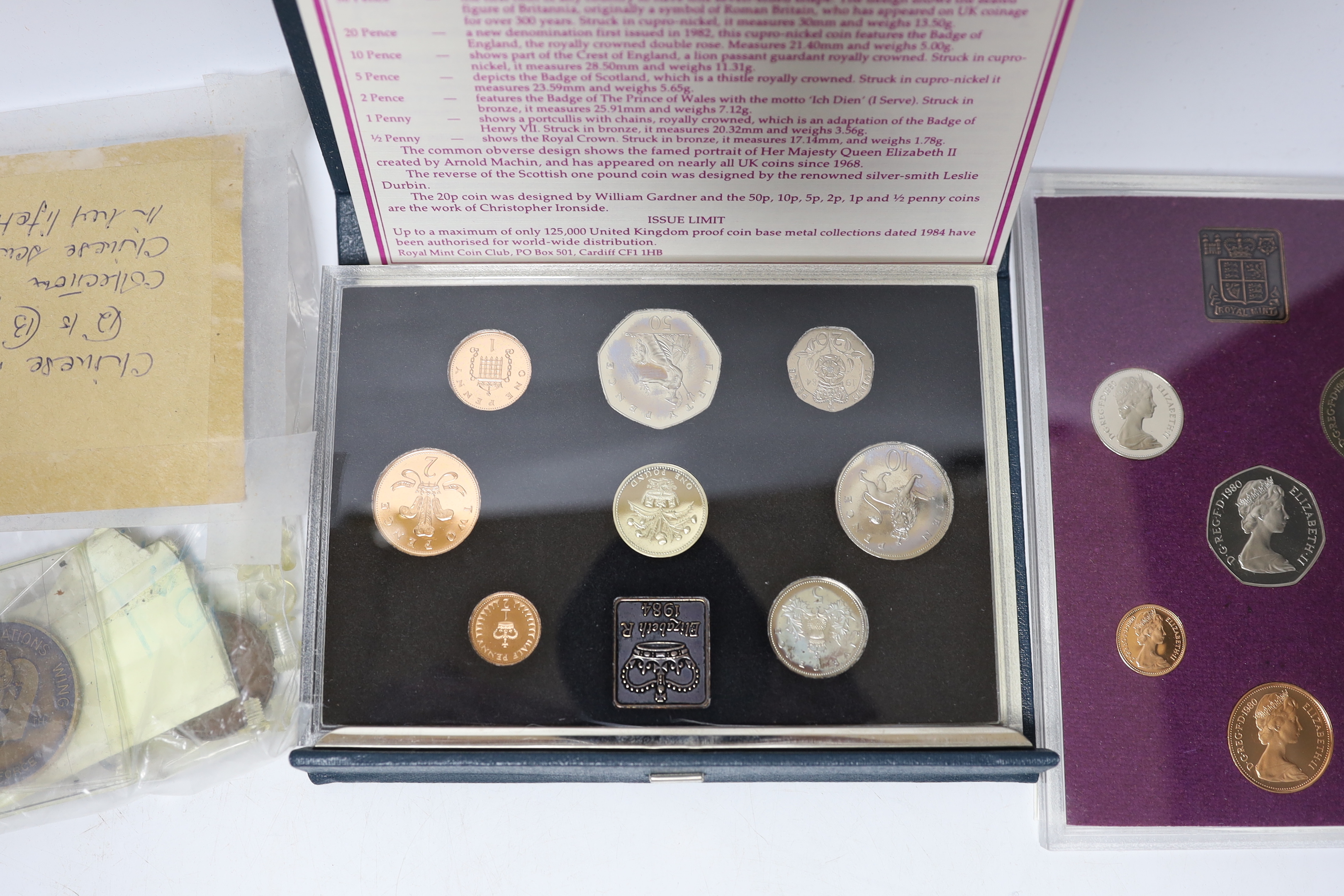 A National Service medal, various Royal Mint proof or BU coin sets etc.